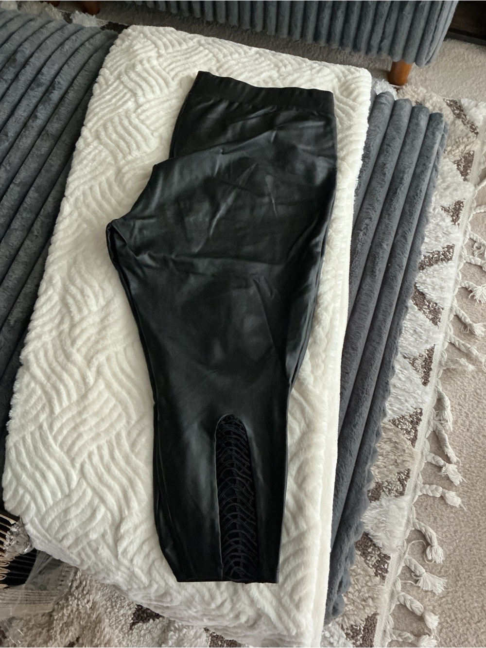 Torrid Women’s cropped faux leather leggings with lattice detail on the back leg